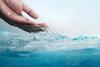 photo-hand-scooping-and-pouring-water-freshness-and-clear-world-water-day-concept-environmental-care